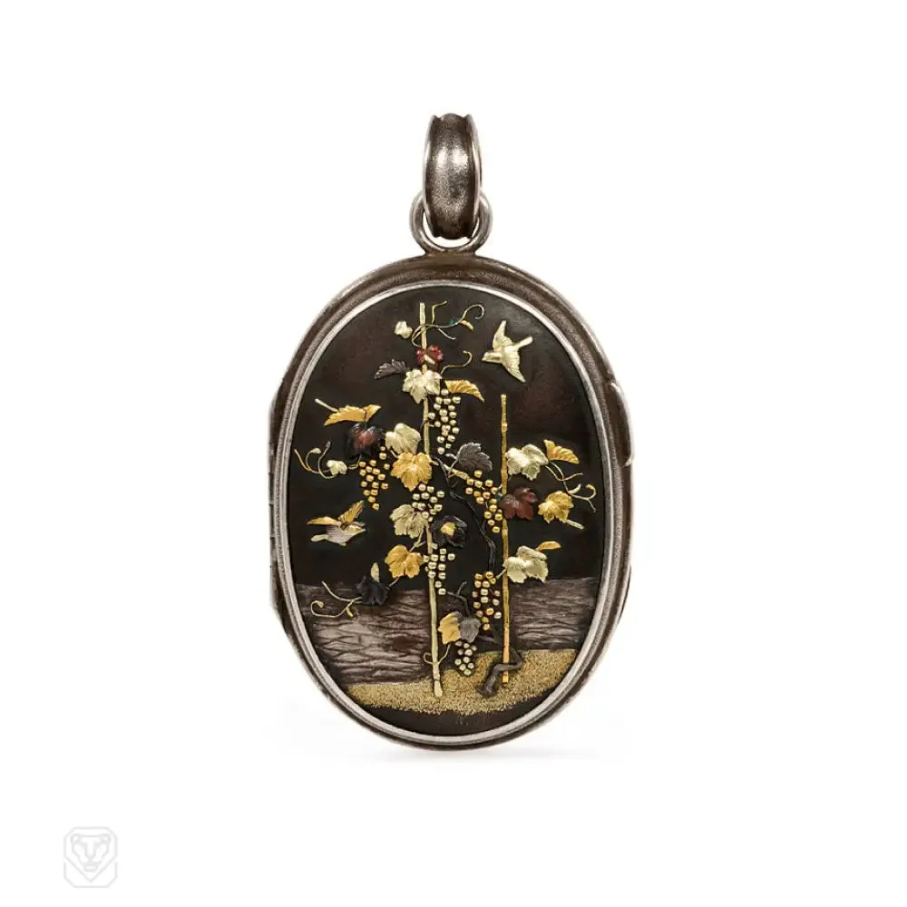 Antique two-sided shakudo locket